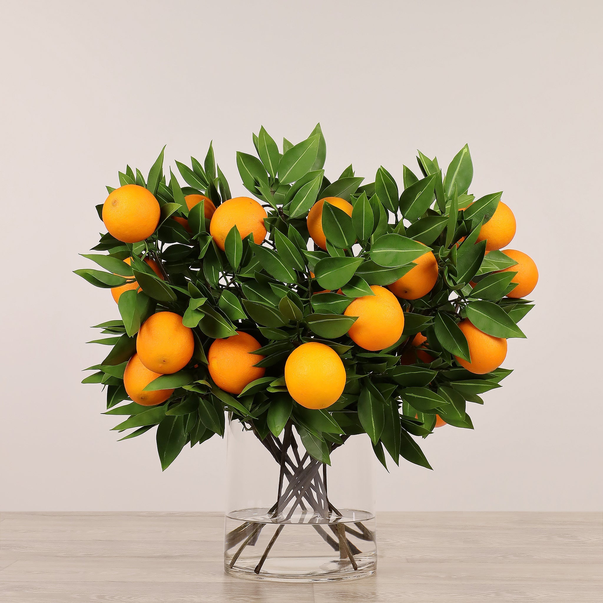 Orange Teardrop Arrangement in Glass Vase